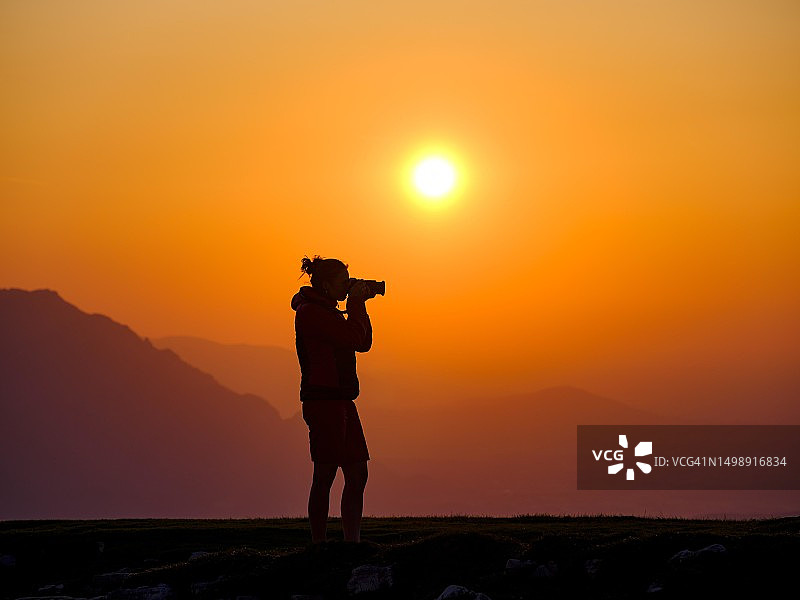 奥地利日落摄影师剪影图片素材