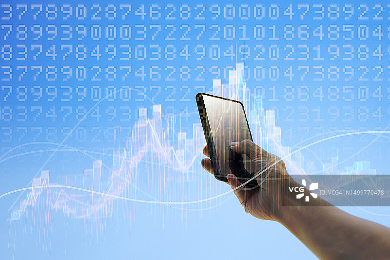 使用手机的手和商业金融图表图片素材