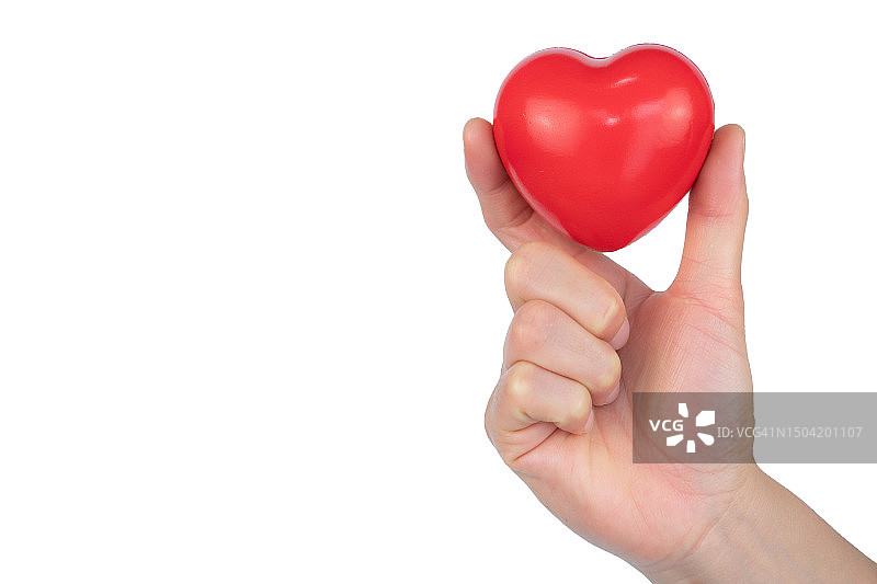 手持红色橡胶爱心的局部照片，白色背景图片素材