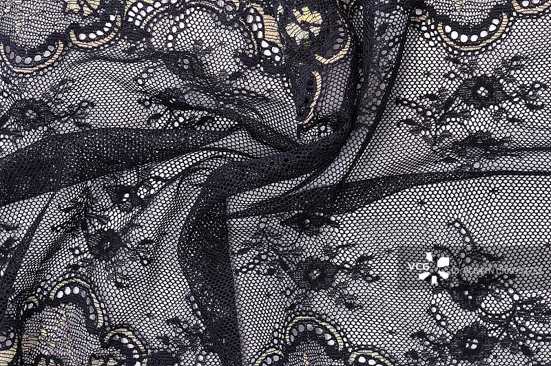 饰有精致花卉图案的奢华黑色蕾丝面料背景，唤起优雅和风格图片素材