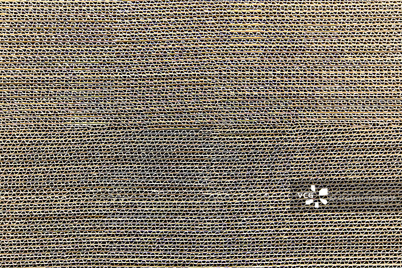 仓库中堆叠的瓦楞纸箱 - 物流行业的纸板运输和存储包装图片素材