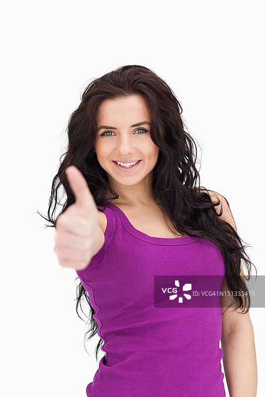 竖起大拇指的蓝眼睛女人图片素材