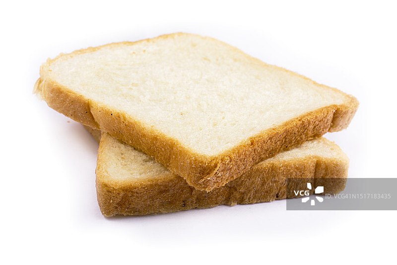 白色背景下的面包特写图片素材