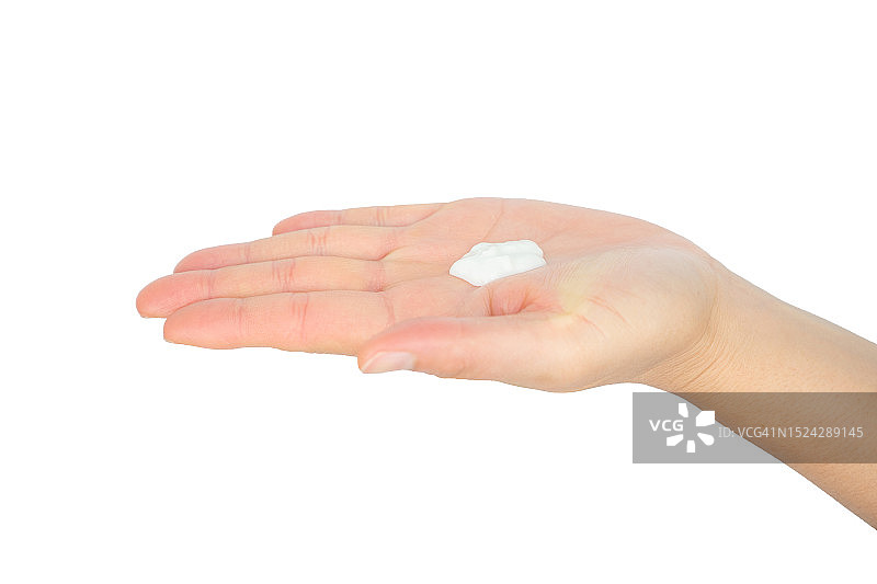 女人手上滴着一滴保湿霜，准备涂抹在皮肤上的局部照片图片素材