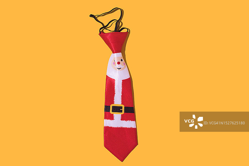 黄色背景上的圣诞老人领带图片素材