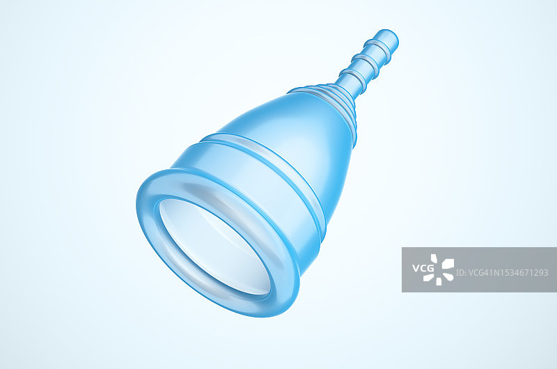 浅蓝色背景上的蓝色月经杯特写图片素材