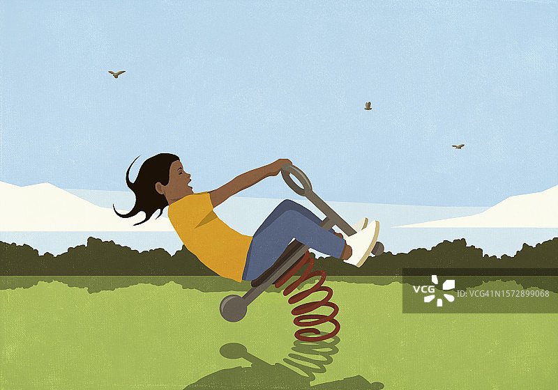 阳光明媚的公园里，女孩在弹簧游乐设施上玩耍图片素材