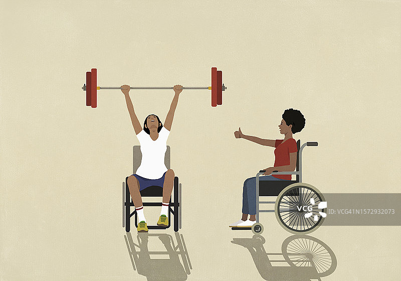 坐在轮椅上的女人为举重的朋友欢呼图片素材
