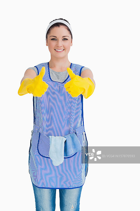 清洁女工戴着黄色手套竖起大拇指图片素材