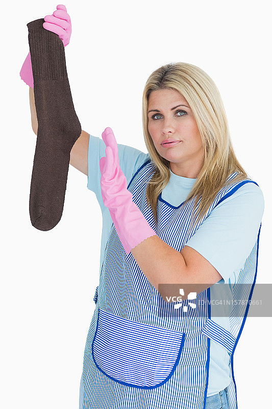 清洁女工拿着脏袜子图片素材