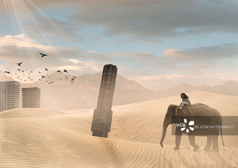 在沙漠中骑大象，背景是城市废墟的女孩图片素材