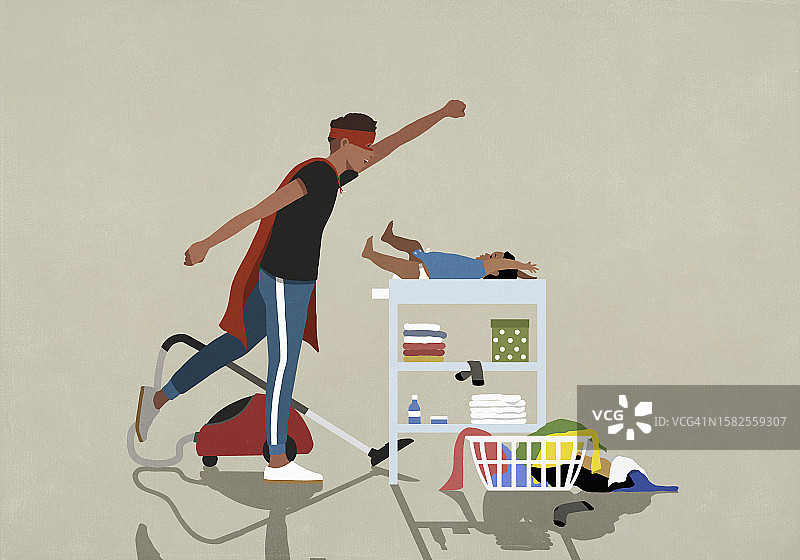 身穿超人披风的居家男人做家务并更换尿布图片素材