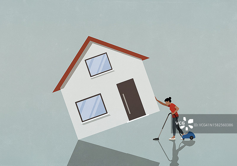 正在房屋下吸尘的健壮女人图片素材