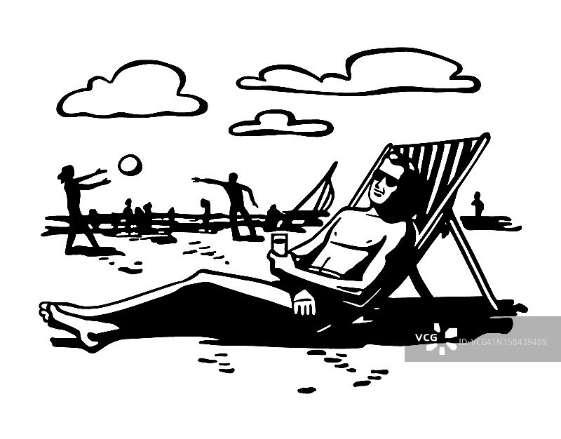 坐在海滩椅子上的男人图片素材