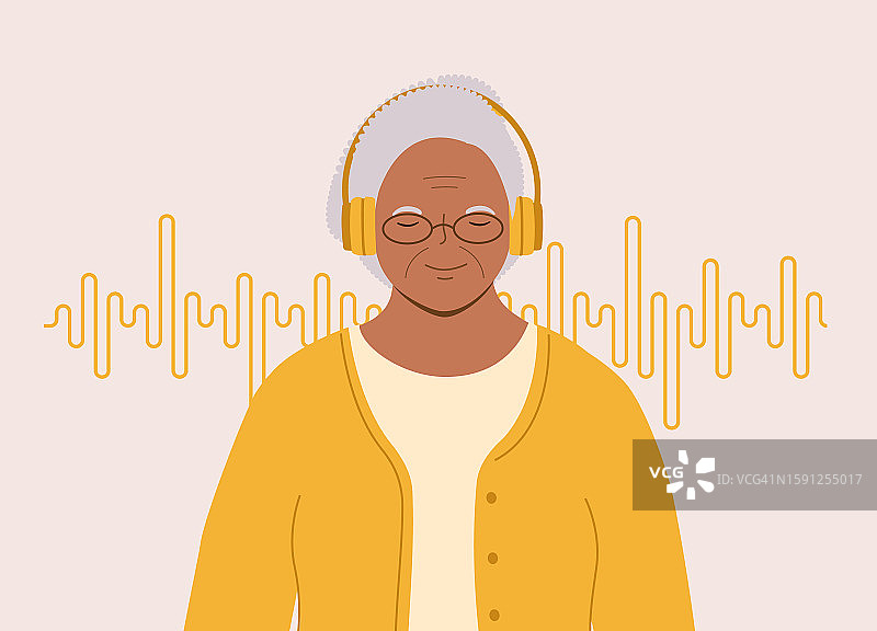年长的黑人女性戴着耳机听音乐图片素材