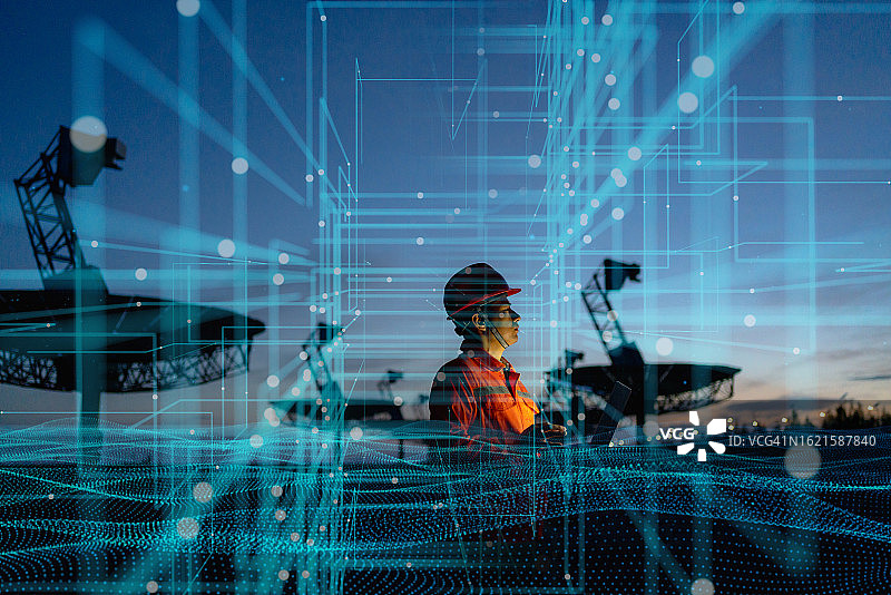 工程师使用笔记本电脑和未来科技图片素材