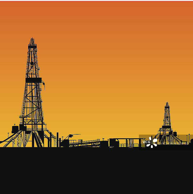 石油钻井平台剪影和橙色天空图片素材