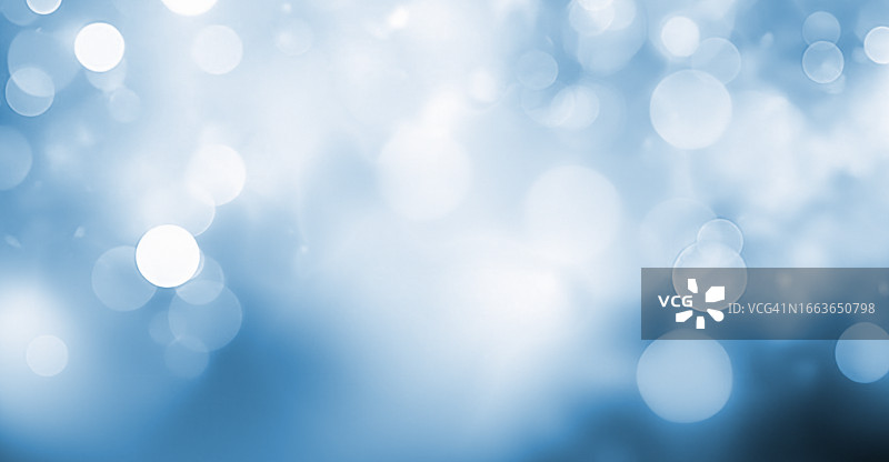 蓝色背景上的虚化光点图片素材