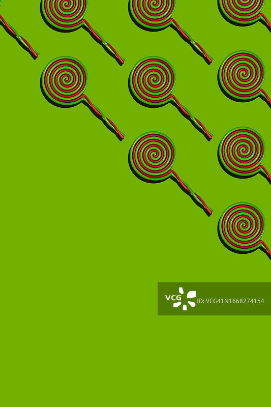 绿色背景上重复的万圣节棒棒糖图案，万圣节庆祝概念图片素材