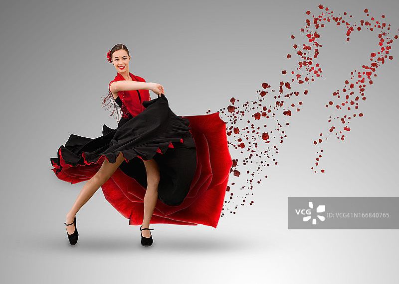微笑的弗拉门戈舞者，心形油漆从裙子中溅出图片素材