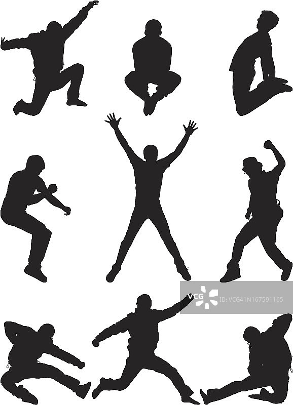 半空中跳跃摆姿势的休闲男人图片素材