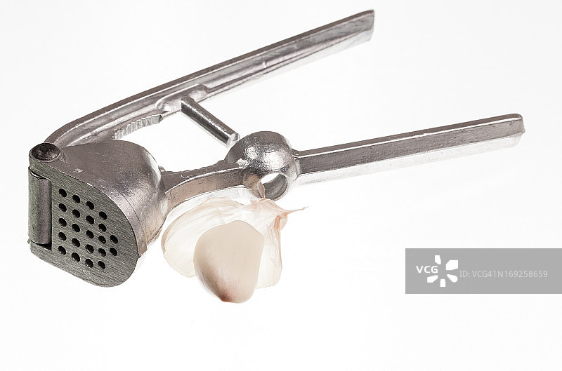 白色背景下的压蒜器图片素材