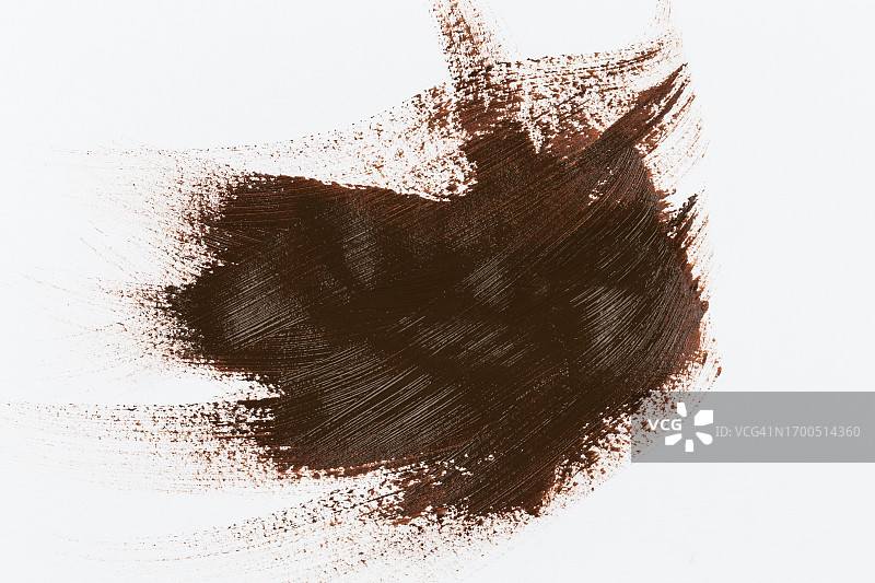 白色纸上棕色画笔笔触图片素材