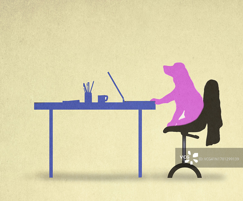 在桌旁使用笔记本电脑的狗的轮廓图片素材