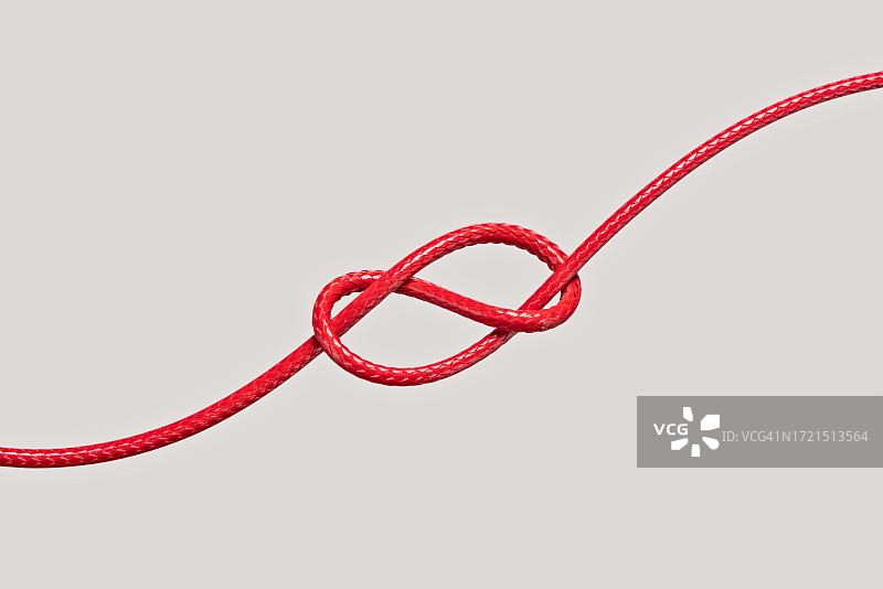 用红绳打的8字绳结图片素材