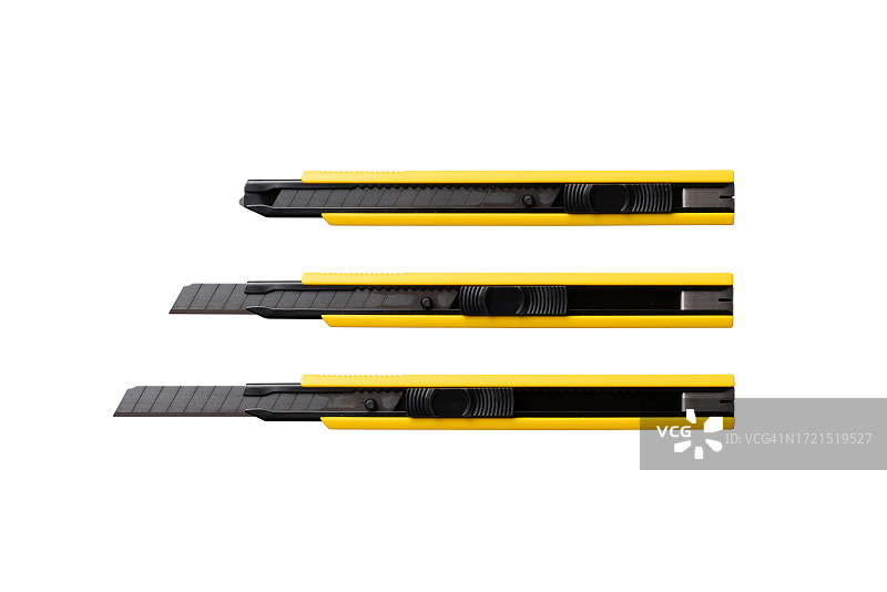白色背景上的黄色美工刀图片素材