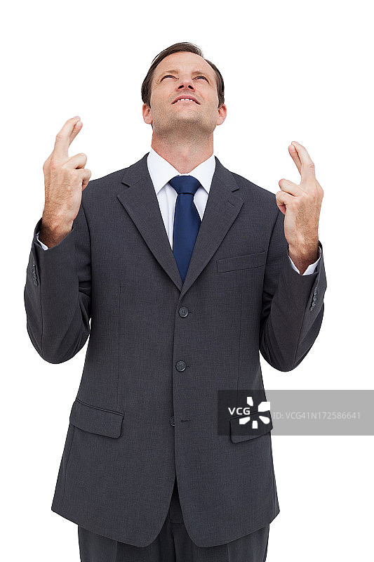 双手交叉向上看的商人图片素材