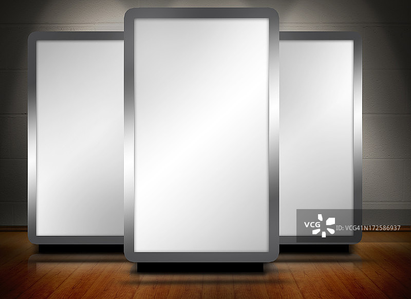 木地板上的三个空白屏幕图片素材