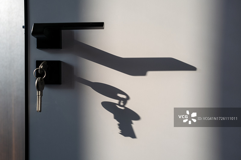 门把手与钥匙的光效图片素材