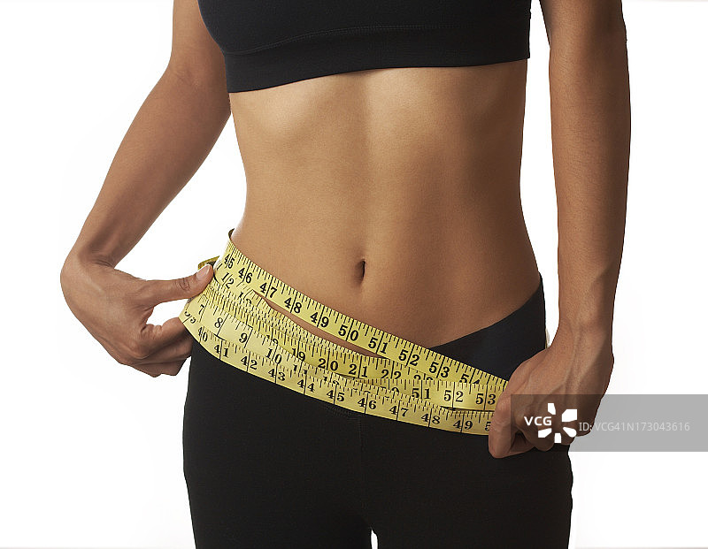 环绕腰部的卷尺图片素材