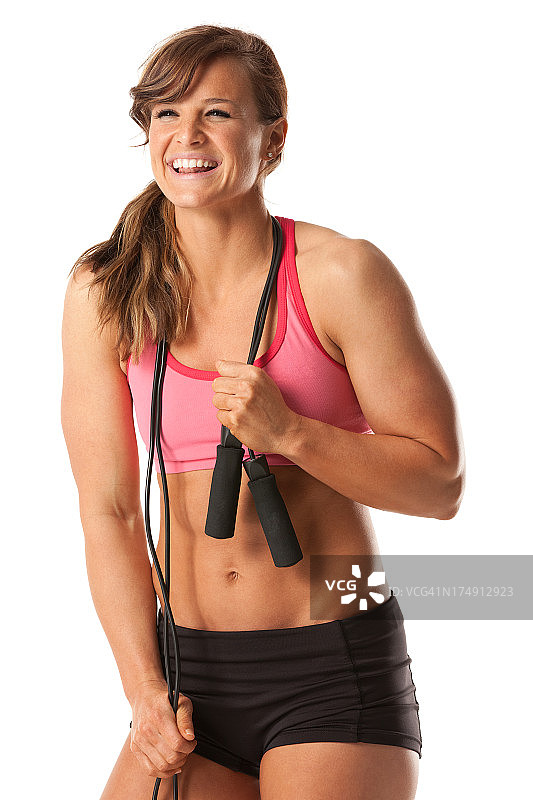 手持跳绳的迷人女运动员图片素材