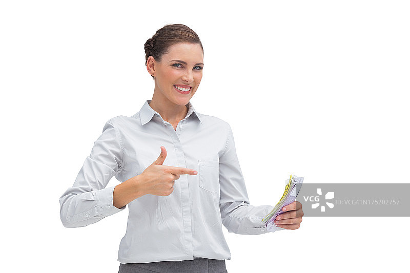 手里拿着钱的快乐女商人图片素材