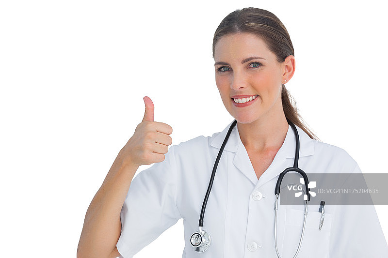 快乐的护士竖起大拇指对着镜头微笑图片素材
