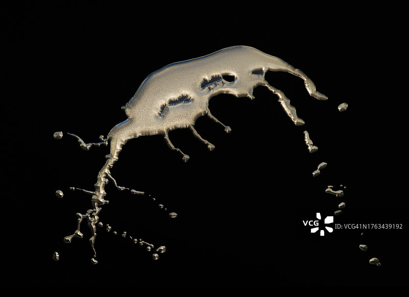 黑色背景上的金色液体飞溅图片素材