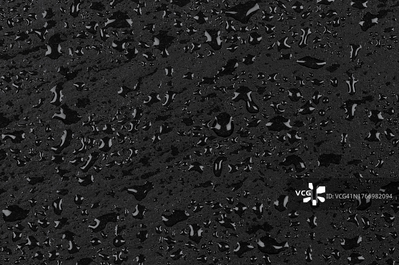 深色石材表面的水滴纹理背景图片素材