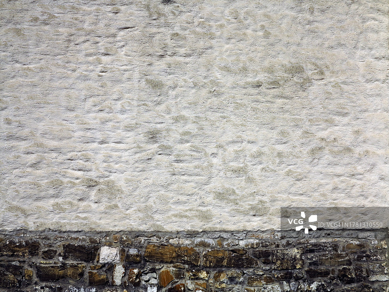 格吕耶尔的白色和棕色石墙，瑞士弗里堡州图片素材