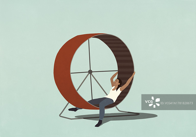 疲惫的女人躺在仓鼠轮里图片素材