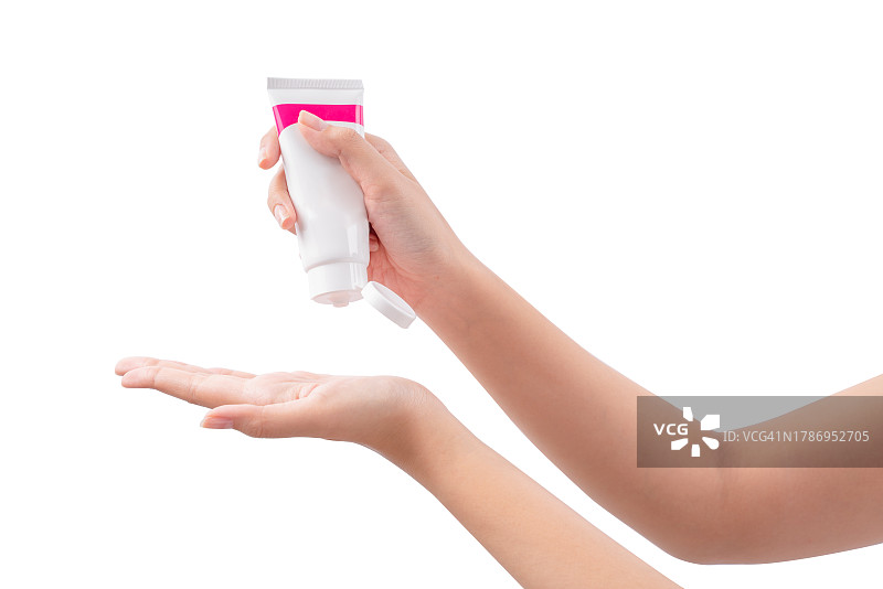 手持白色背景下的塑料软管空瓶图片素材