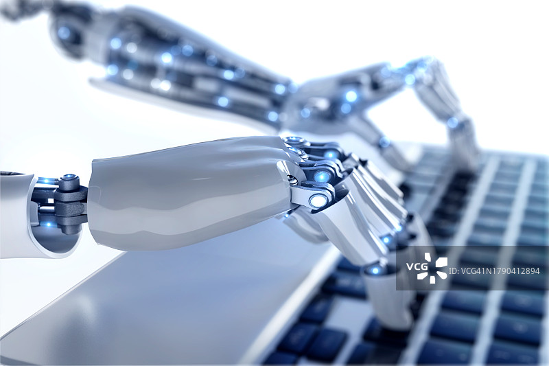 机器人使用笔记本电脑图片素材