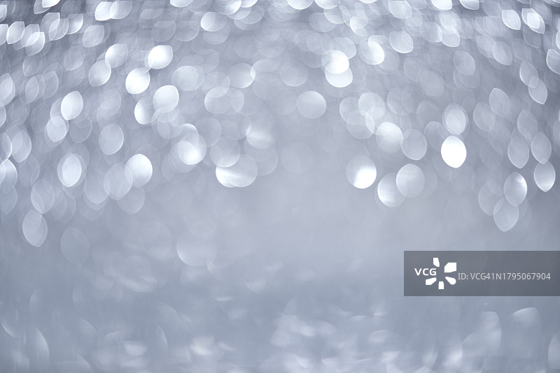 圣诞背景上的银色散景灯光图片素材