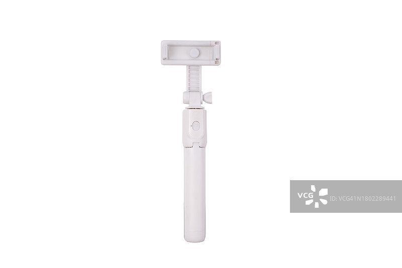 白色背景上的可伸缩自拍杆，末端带有可调节夹具图片素材