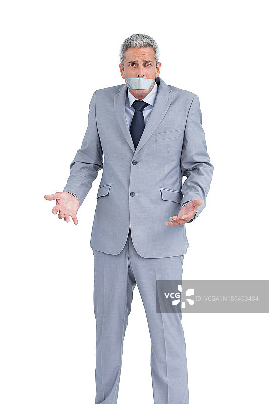 嘴巴被胶带封住的商人图片素材