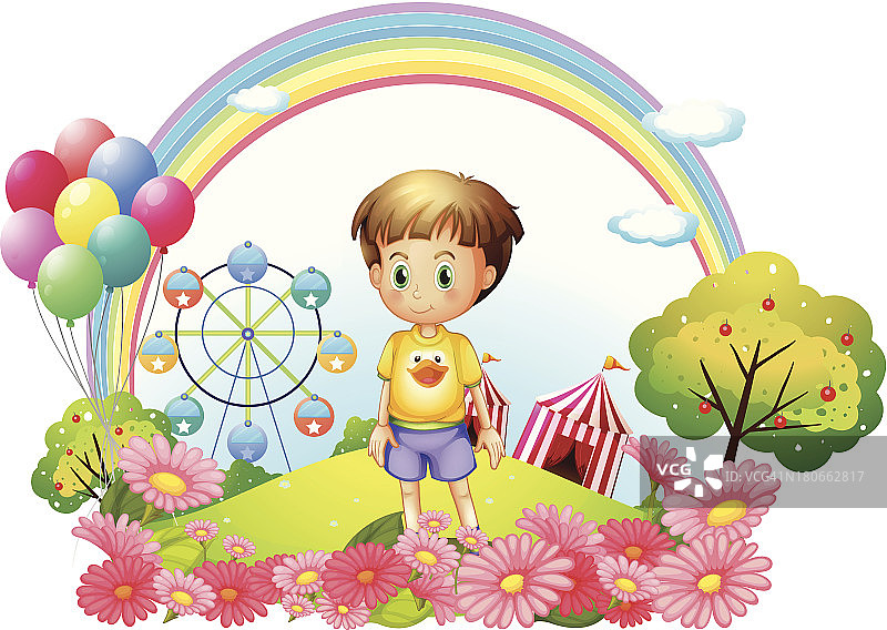 在有花园和嘉年华的山上的男孩图片素材