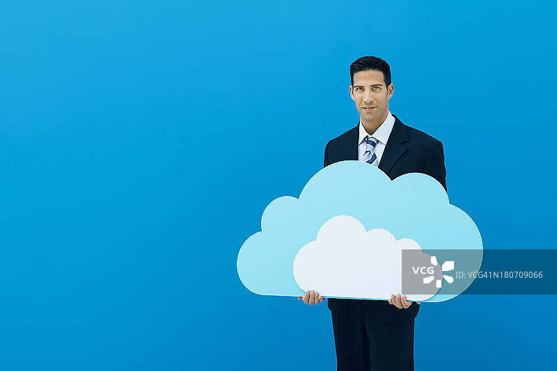 商人拿着蓝色云朵图片素材