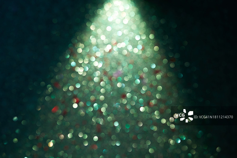 绿色背景与圣诞树形状的闪光图片素材