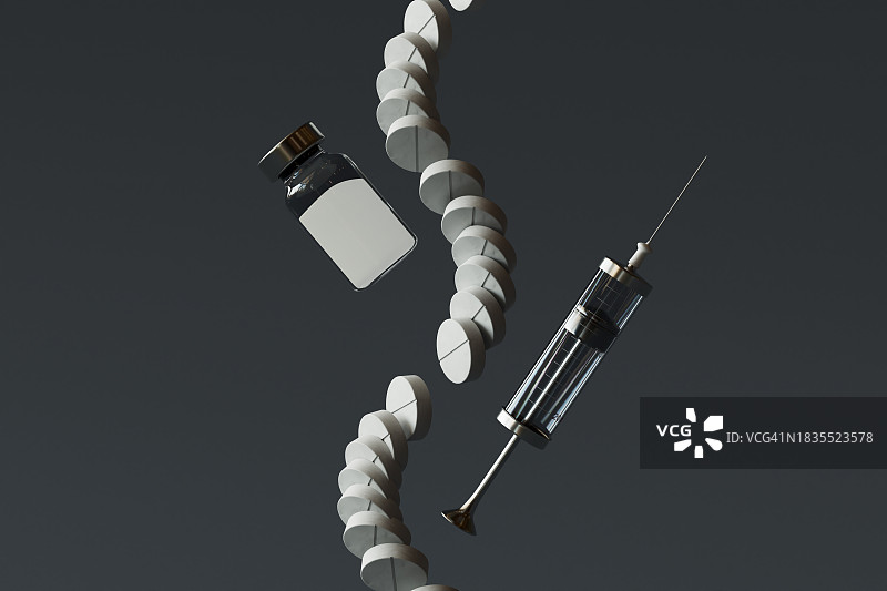 黑色背景下的医疗注射器、药丸和小瓶图片素材